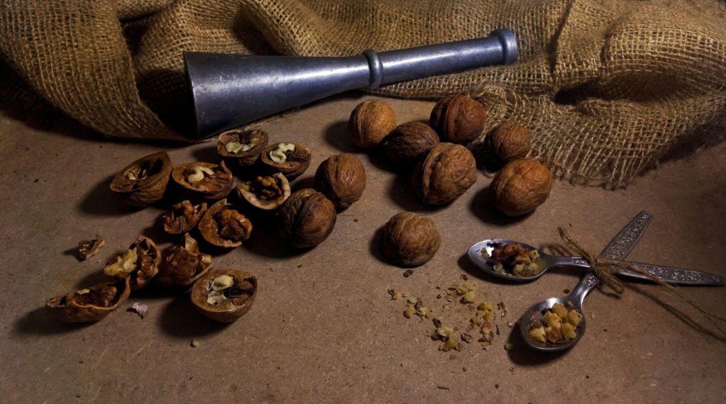 brown and silver tobacco pipe and brown coffee beans